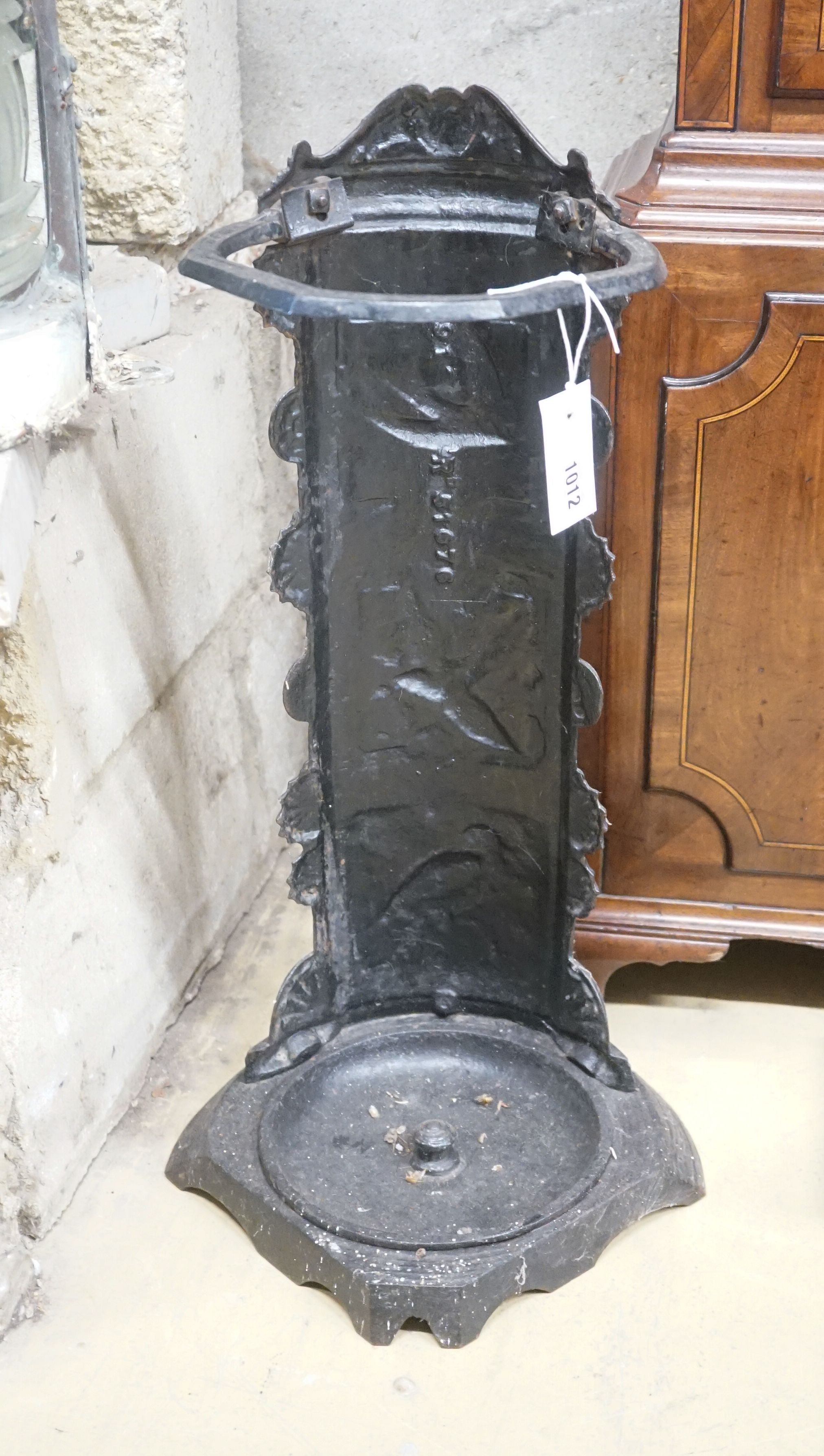 A cast iron panelled umbrella stand, height 66cm